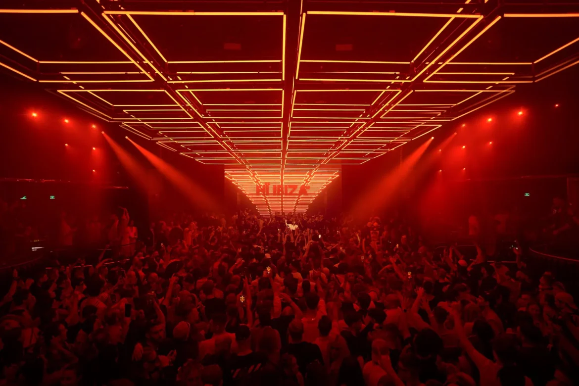 Hï Ibiza 2025 club interior with lights and DJ crowd